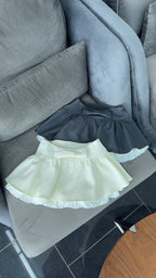 BOW PEPLUM SKIRT